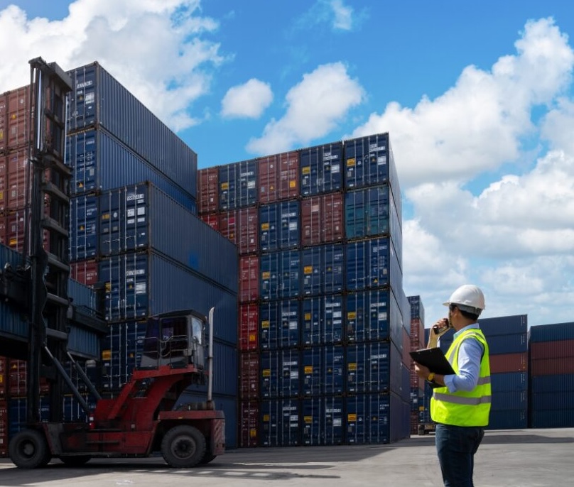 Foreman reviewing containers in a yard