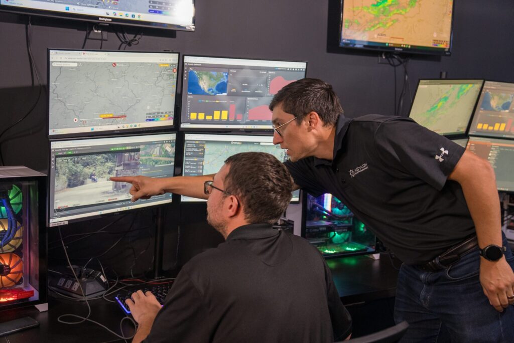 Two RSOC employees reviewing a possible security incident