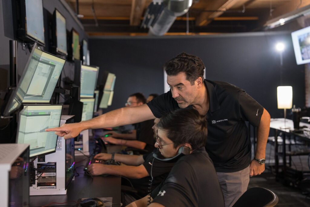 RSOC team members call a client and consult on a recent security alert
