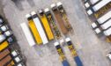 High-angle aerial view of a trucking depot or shipping yard