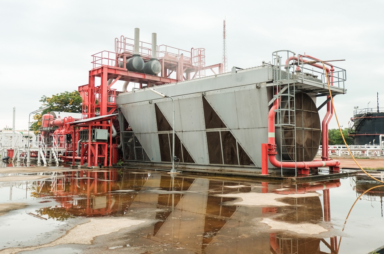 Gas compressor located in a remote section of an oil processing facility.