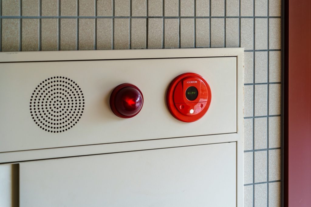 Fire alarm and emergency notification system mounted inside an industrial manufacturing facility. 