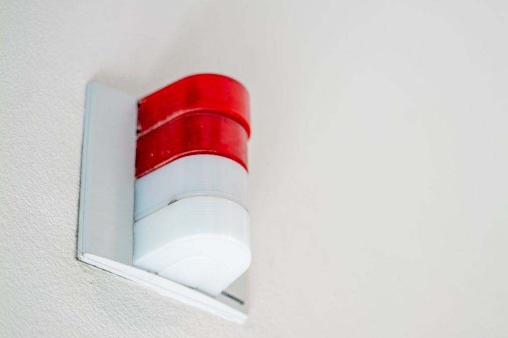 Mounted red alarm on the wall of a waste water or water treatment plant