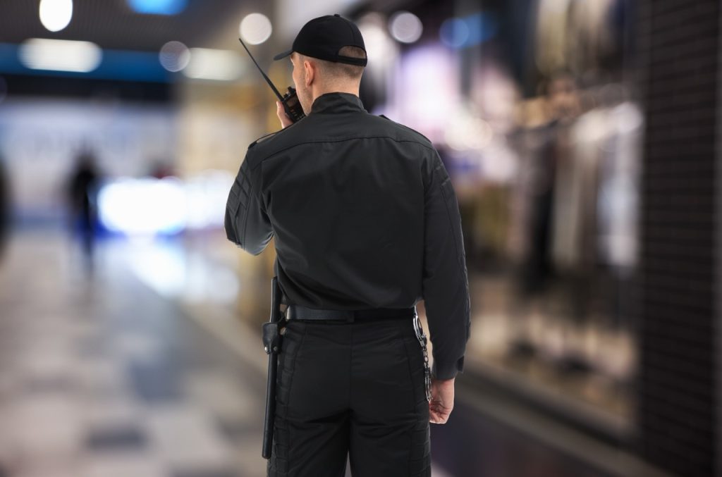 Security guard conducting an interior patrol at a distribution center facility. 