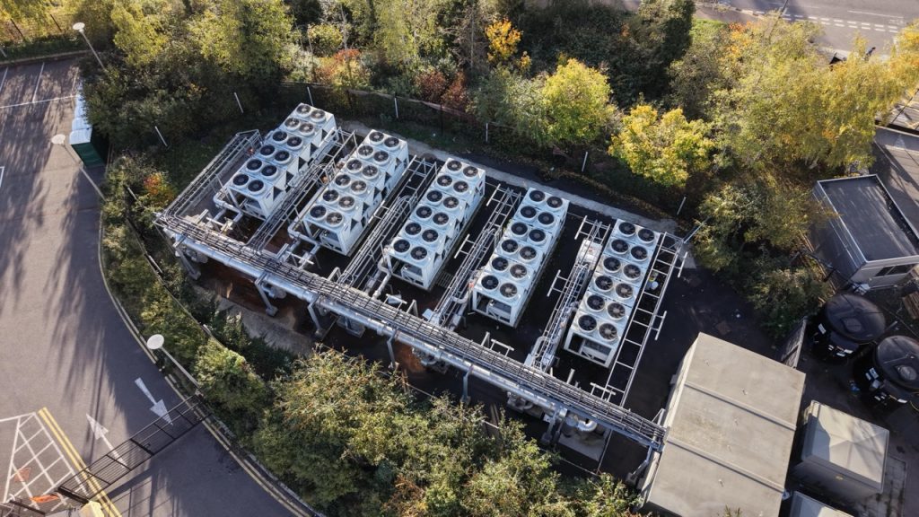 Aerial view of data center cooling equipment and utility infrastructure within the secured campus. 
